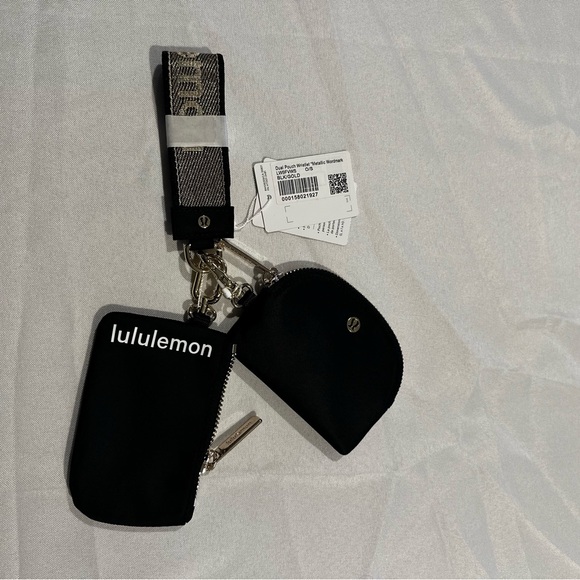 NWT Lululemon black and gold dual pouch wristlet SOLDOUT COLOR